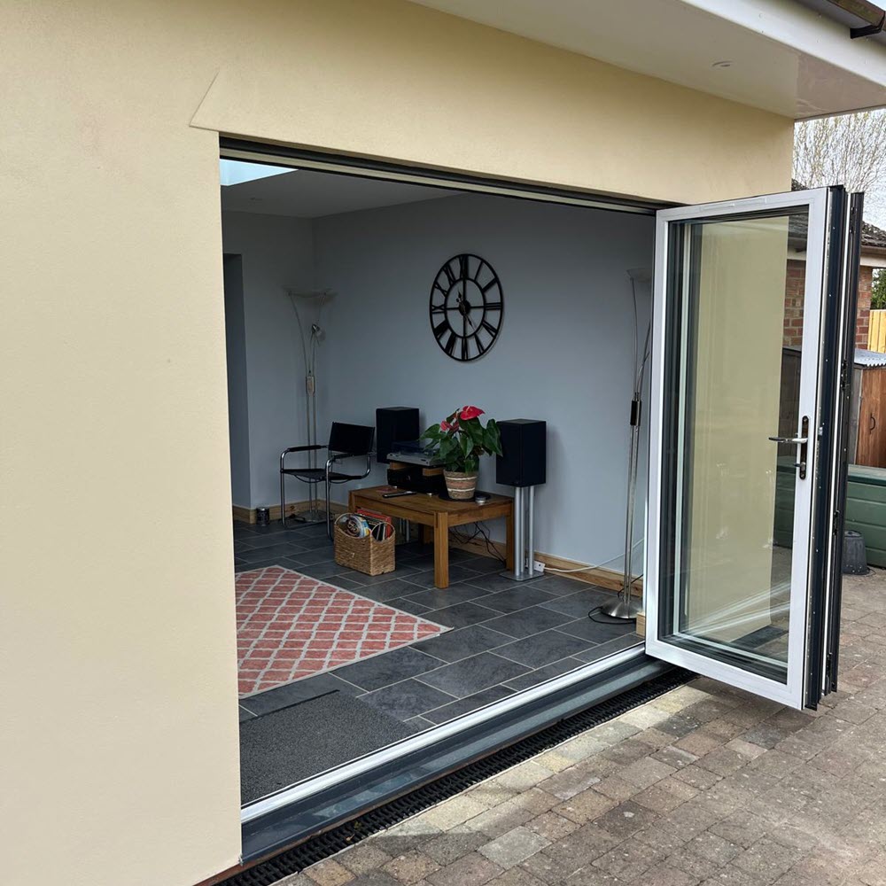 Bifold doors opening to garden from new extension in Stowmarket by Buildright Suffolk